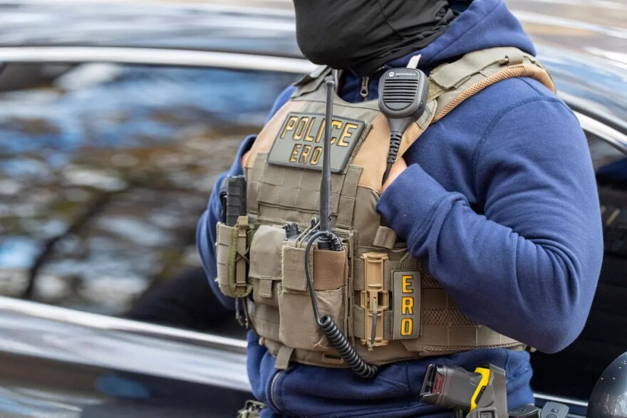 Federal law enforcement officers with Immigration and Customs Enforcement (ICE) and Enforcement and Removal Operations (ERO) conduct a traffic stop and detain people , in Washington on Monday, Nov. 17, 2025.