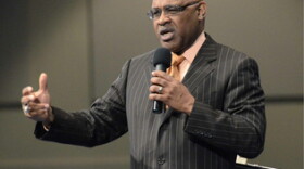 Bishop Phillip Davis delivers his sermon during Sunday's service at Nations Ford Community Church. He is encouraging his members