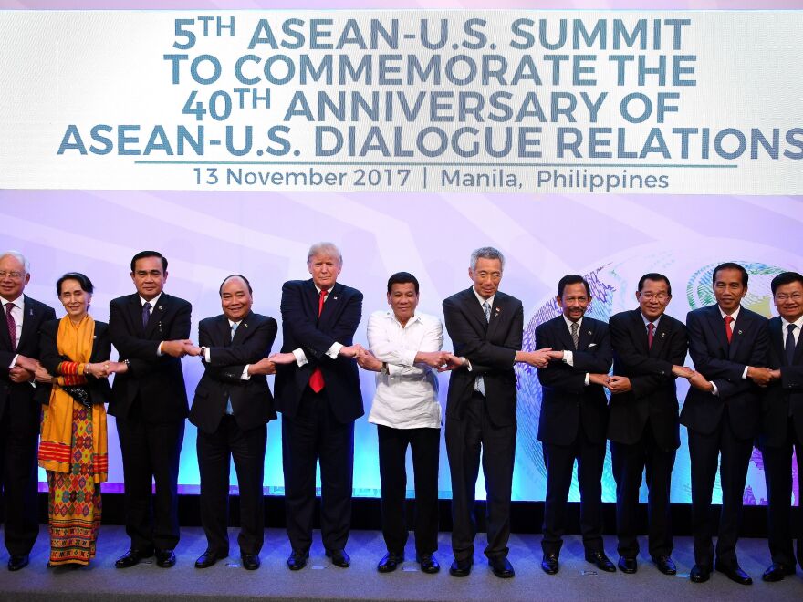 Asian leaders and President Trump pose for a photo during the Association of Southeast Asian Nations Summit in Manila on Monday.