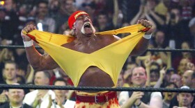 FILE - in this April 3, 2005, file photo, Hulk Hogan fires up the crowd, ripping his yellow tank off between matches during WrestleMania 21 in Los Angeles.