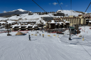 Crested Butte Mountain Resort covered in snow with skiers all around.