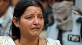 A grieving woman at the scene of today's fire in Kolkata.
