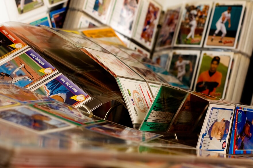 Collection of baseball cards in binders.