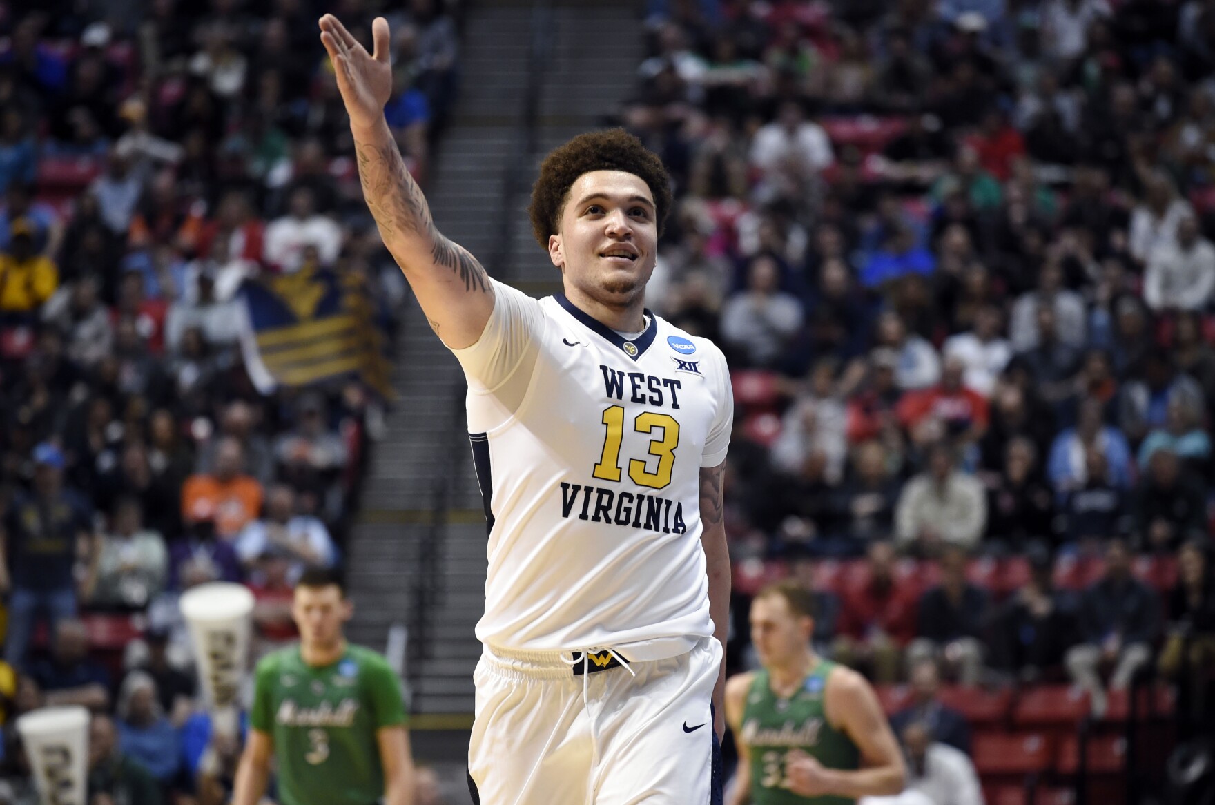 WVU forward Teddy Allen gestures during the first half of the team's second-round NCAA college basketball tournament game against Marshall on Sunday, March 18, 2018, in San Diego. 
