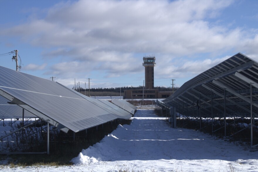 Solar panels, and the shuttered air traffic control tower, on Nov. 19, 2025.