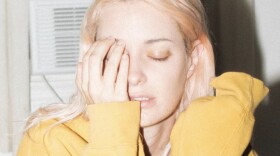 Men I Trust singer Emmanuelle Proulx poses with one hand over her eye.