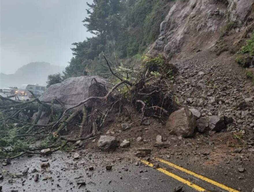A landslide across Hwy 101 ten miles north of Florence shut down traffic for hours Saturday.