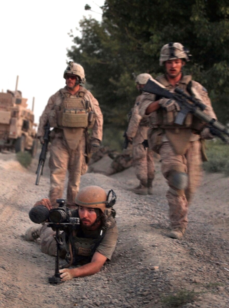 <p>Director Danfung Dennis (bottom left) shot <em>Hell and Back Again</em> in part while embedded with Harris' unit — Echo Company, 2nd Battalion, 8th Marine Regiment.</p>