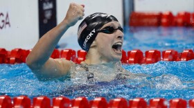 Katie Ledecky of the United States celebrates winning gold and setting a new world record in the Women's 400m Freestyle Final on Day 2 of the Rio 2016 Olympic Games at the Olympic Aquatics Stadium on Aug. 7, 2016 in Rio de Janeiro, Brazil. (Clive Rose/Getty Images)