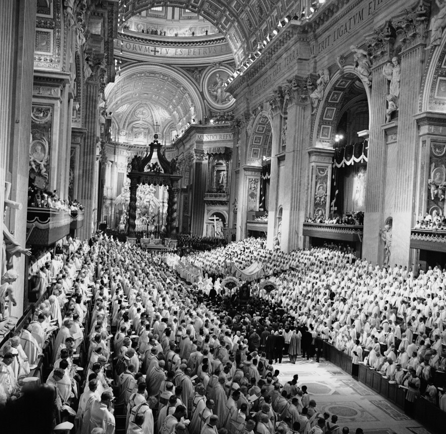 Pope John XXIII is carried on a portable throne down the aisle in St. Peter's Basilica on Oct. 11, 1962. Despite the pontiff's call for openness, certain issues — such as priestly celibacy — remained off-limits.