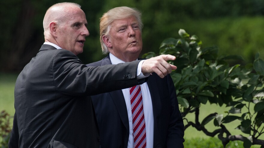 President Trump listens to then-Director of Oval Office Operations Keith Schiller at the White House on June 12.