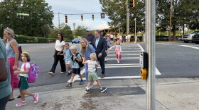 Students and parents walk into Beverly Woods Elementary School on the first day of the 2026-27 school year.