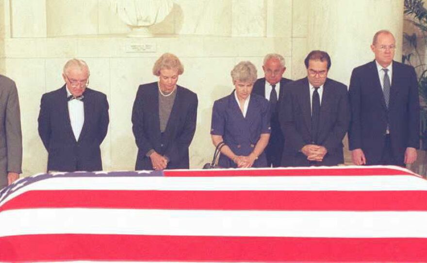 Supreme Court Justices pay their respects in front of the casket of former Justice Warren E. Burger in 1995. From the left are Justices William Rehnquist, John Paul Stevens, Sandra Day O'Connor, Mrs. Lewis Powell, wife of a retired justice, Justices Antonin Scalia, Anthony Kennedy and Ruth Bader Ginsburg.