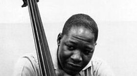 Curtis Counce, black & white portrait with string bass.