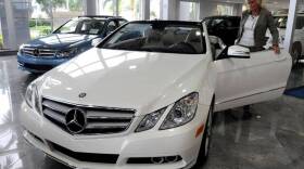 A shopper considers a car at the the Mercedes-Benz dealership at 4250 North State Road 7 in Coconut Creek. A new bullying scholarship is funded by redirecting sales taxes on vehicle purchases.