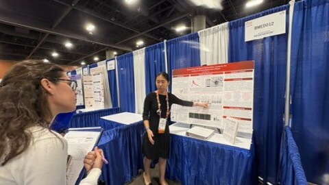 Lily Ma explains her research to judges at this year's Regeneron International Science and Engineering Fair in Phoenix, Arizona.