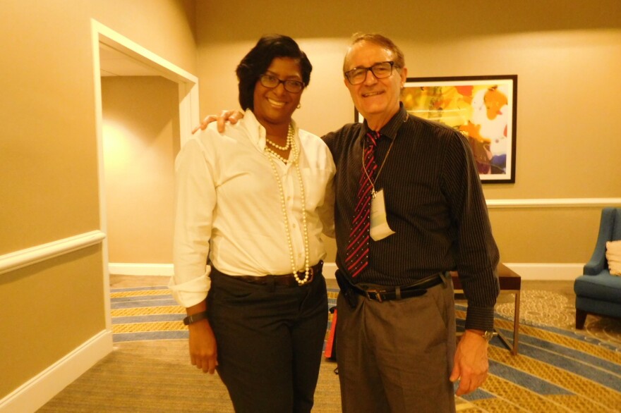 Michelle Evans-Oliver and Craig Woodson pose for a photo together at their first meeting in 2016. They would come to find out later that they are related.