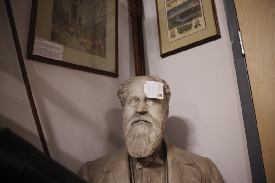 A Post-it note marks the bust of Mortimer Reynolds that sits in a corner of the Rochester Historical Society's new home on University Avenue.