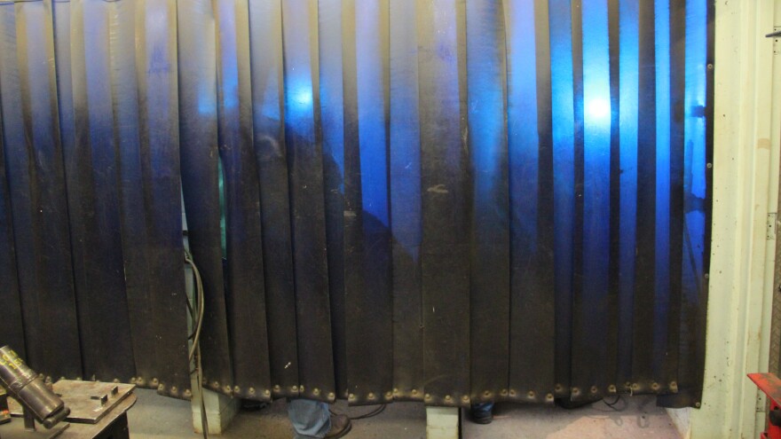 Members of Boilermakers Local 154 in Pittsburgh practice welding behind a safety curtain at the union's training hall.