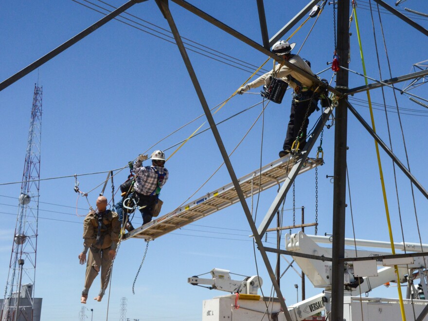 Lineman and Electricians train with the APA-5 Atlas Powered Ascender to recover rescue dummy prior to the onset of suspension trauma.