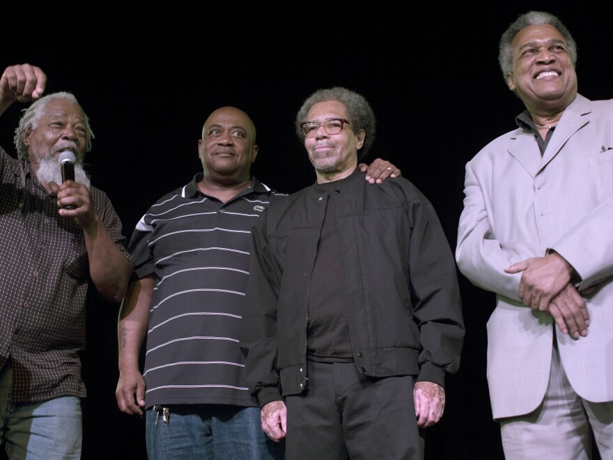 Albert Woodfox, (second from right), with his brother Michael Mable (second from left) at the Ashe Cultural Arts Center in New Orleans in February. Woodfox of the "Angola Three," had just been released from Louisiana State Penitentiary.