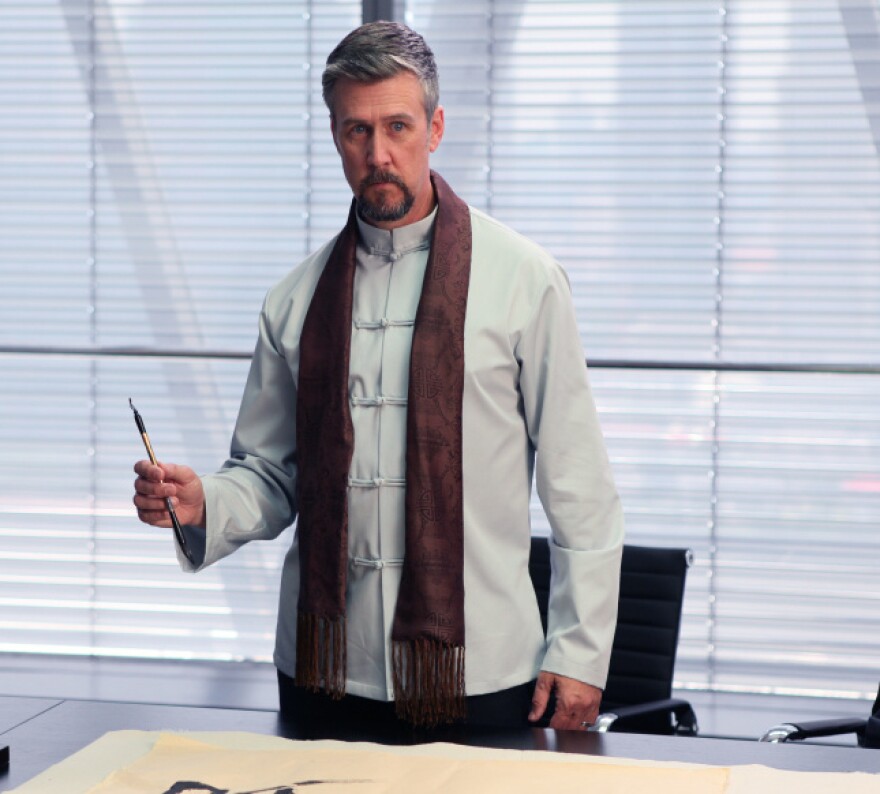 Alan Ruck plays Marcus Groff, a billionaire technology executive from Texas who travels to China in search of a new invention.