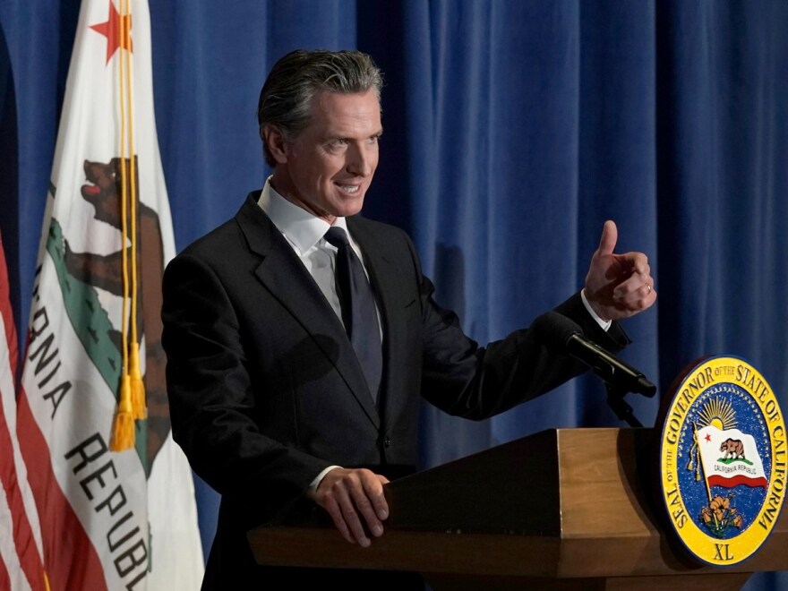 California Gov. Gavin Newsom unveils his 2022-2023 state budget revision during a news conference i in Sacramento, Calif., Friday, May 13, 2022. California is expected have a record surplus.