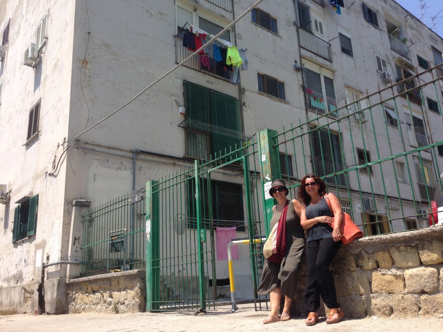 Naples locals Lia Polcari (right), Carmen Vicinanza (left) in front of what they believe to be the childhood home of author Elena Ferrante.