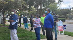 Voters line up to cast their ballots at Beatties Ford Road Library on Thursday, Oct. 15.