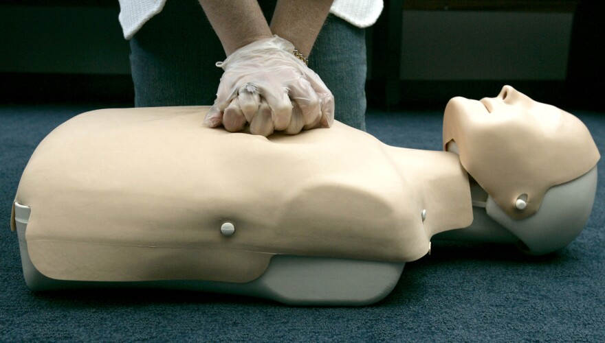 American Red Cross "hands-only" CPR training, using an inflatable mannequin