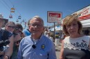 Ohio Gov. Mike DeWine and First Lady Fran DeWine speak to reporters on the midway at the 2025 Ohio State Fair in Columbus.