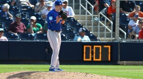 Eric Hanhold #70 of the New York Mets gets set to deliver a pitch as the pitch clock counts down during the ninth inning of a spring training baseball game against the Houston Astros at Fitteam Ballpark of the Palm Beaches on March 11, 2019 in West Palm Beach, Florida. The Astros defeated the Mets 6-3. (Rich Schultz/Getty Images)