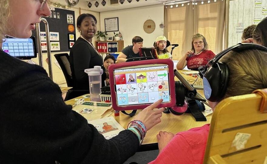 Mary Cariola Center educators and middle-school students finish up a lesson before dismissal at the East Henrietta Road Campus on Monday.