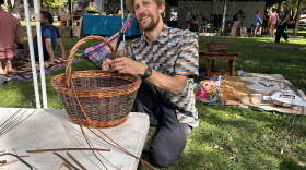 Artist Jeff Wagner weaving a basket at Mountain Harvest Festival.