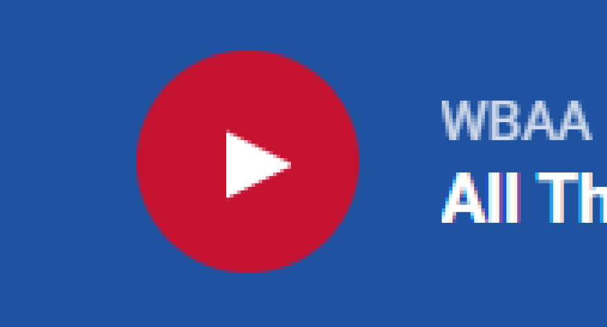 red circle with white triangle in middle