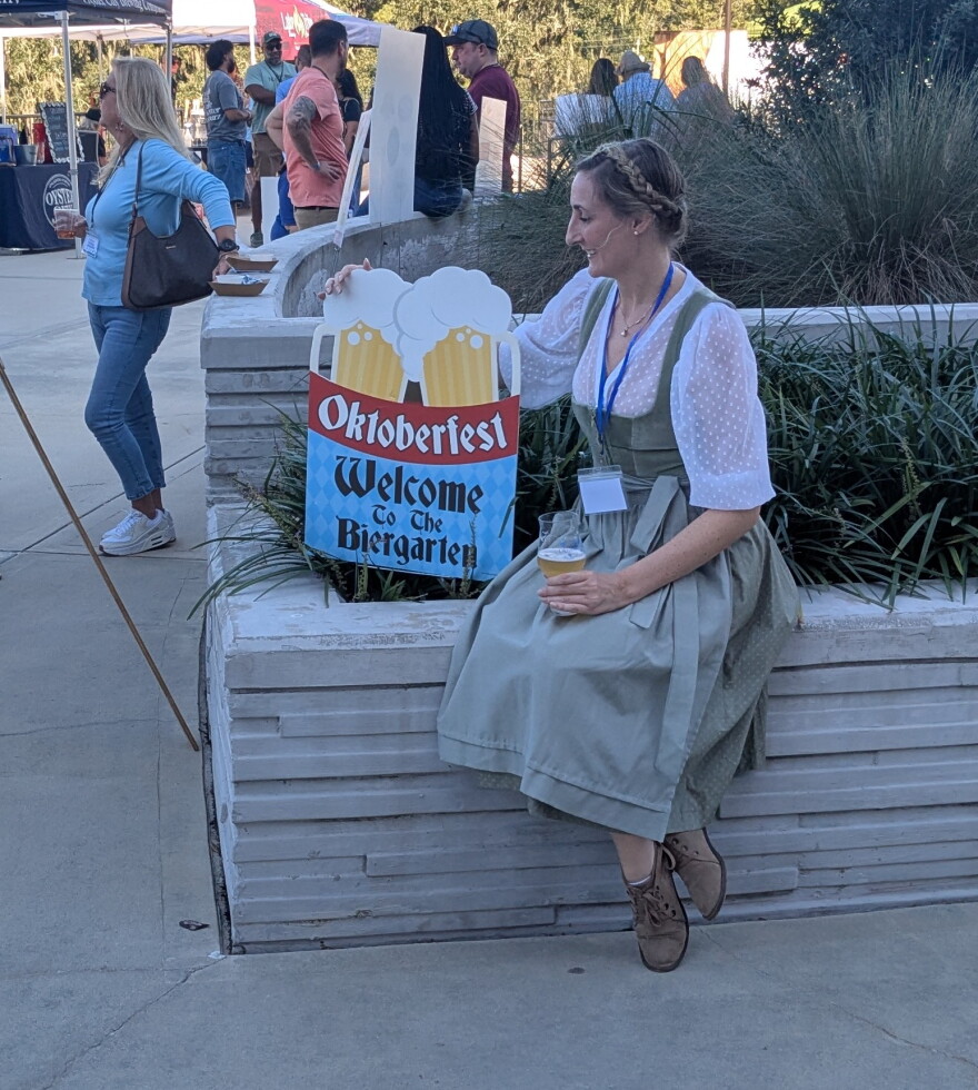 In the finest Bavarian beer hall tradition, a friendly fraulein welcomed Oktoberfest attendees.