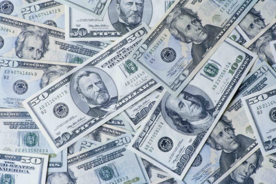 A picture of American currency spread around.