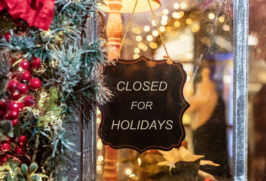 Closed for Christmas holidays, New Year vacations. text on signboard, board on window of cafe, shop, store in winter. High quality photo