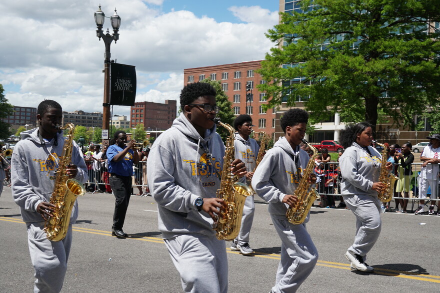 Riverview Gardens High School Marching Band saxophone members perform during the 109th Annie Malone May Day Parade. 
