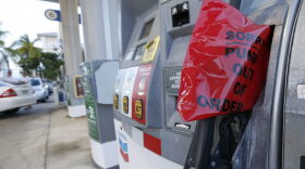A covered gas nozzle is shown at a Chevron gasoline station as motorists scramble to buy gas in preparation for Hurricane Matthew, Wednesday, Oct. 5, 2016, in Hollywood, Fla. Hurricane Matthew marched toward Florida, Georgia and the Carolinas and nearly 2 million people along the coast were urged to evacuate their homes Wednesday, a mass exodus ahead of a major storm packing power the U.S. hasn't seen in more than a decade. (AP Photo/Wilfredo Lee)