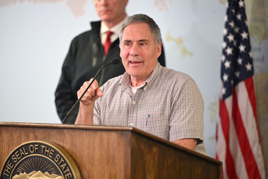 a man speaks at a podium