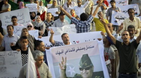 Libyans shout slogans at a rally in rebel-held Benghazi, in eastern Libya on July 31. The rally was held to  pay respect to Abdel-Fattah Younis, the Libyan rebels' slain military chief. Now, his family, tribesmen and supporters are demanding answers from the rebel authorities about his death.