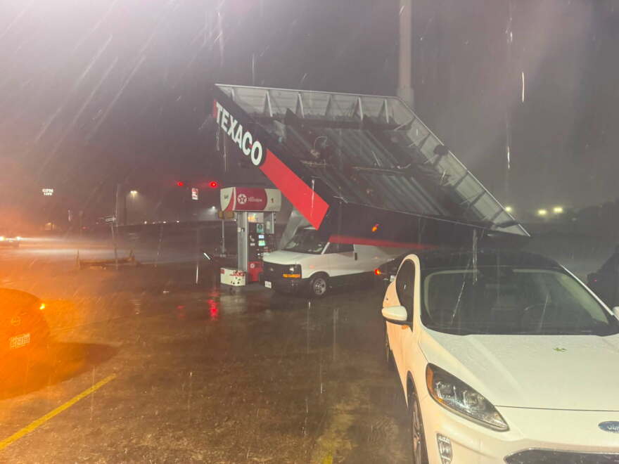A Texaco gas station canopy collapsed onto vehicles during severe storms on San Antonio’s North Side Friday night, Aug. 28, 2026