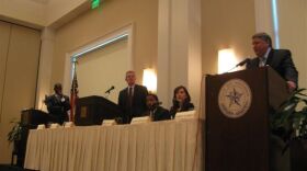 DA Craig Watkins (r) listens to challenger Danny Clancy