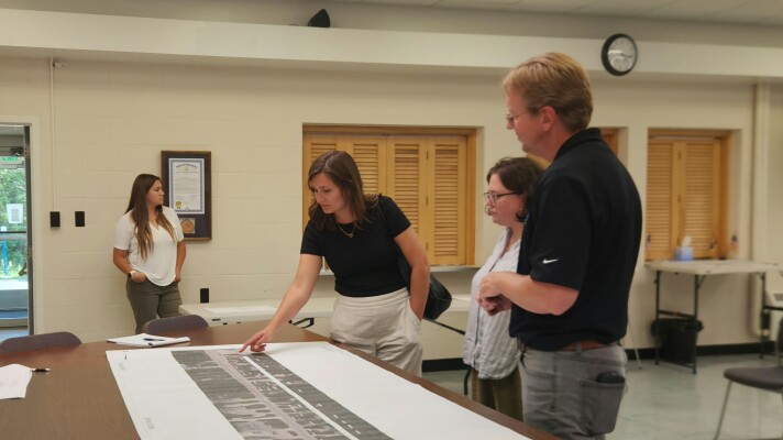 Alpena Transportation Service Center Manager Kevin Schaedig (right) speaks with Anne Gentry and Jessica Luther about a project to extend a bike path at the Charter Township of Alpena Office on Thursday, August 6, 2026.