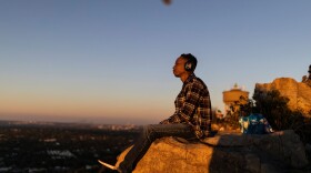 A man listens to music with headphones. (Guillem Sartorio/AFP via Getty Images)