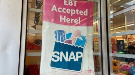 A sign shows electronic benefit transfer (EBT) cards used for SNAP benefits is accepted at a store in Columbus.