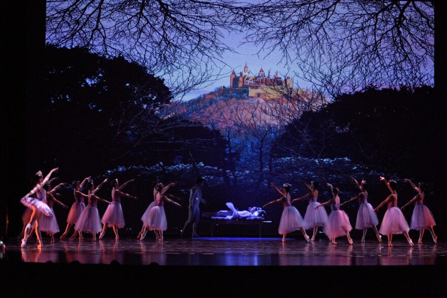 Ballet dancers on a stage.