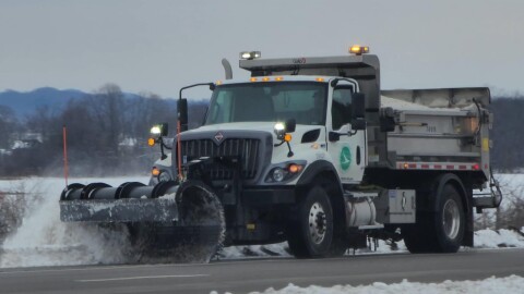 a snow plow plowing snow
