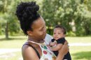 Venessa Aiken holds her son Jahzir Robinson, 5 weeks old, outside their home Sunday, Aug. 21, 2022, in Orlando. States around the country are making it easier for newborn moms to keep Medicaid in the year after childbirth, a crucial time when depression and other health problems can develop.